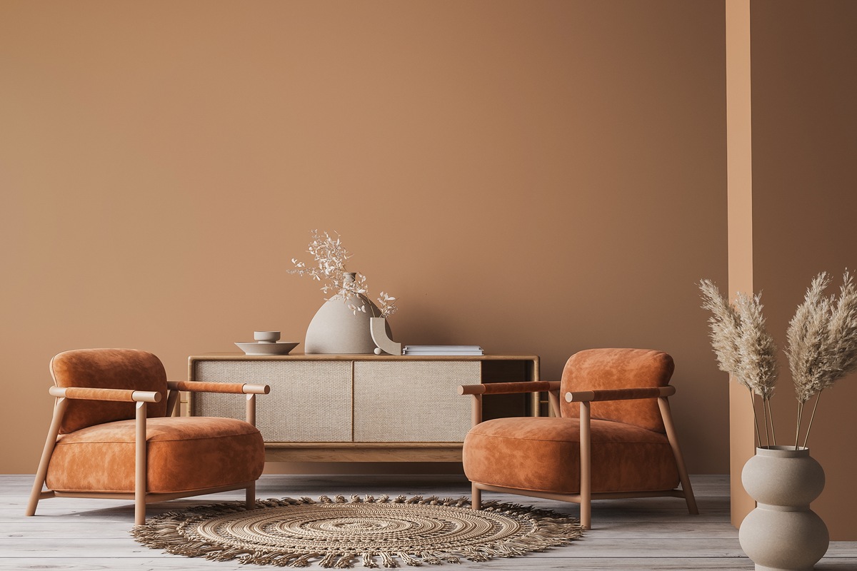 Cozy home interior with wooden furniture on brown background, empty wall mockup in boho decoration